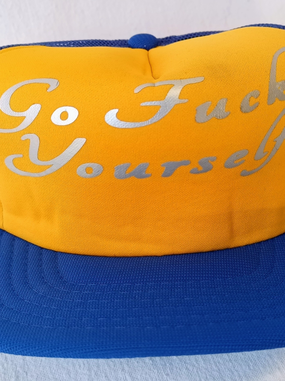 Yellow and Blue Trucker Hat with Silver Script